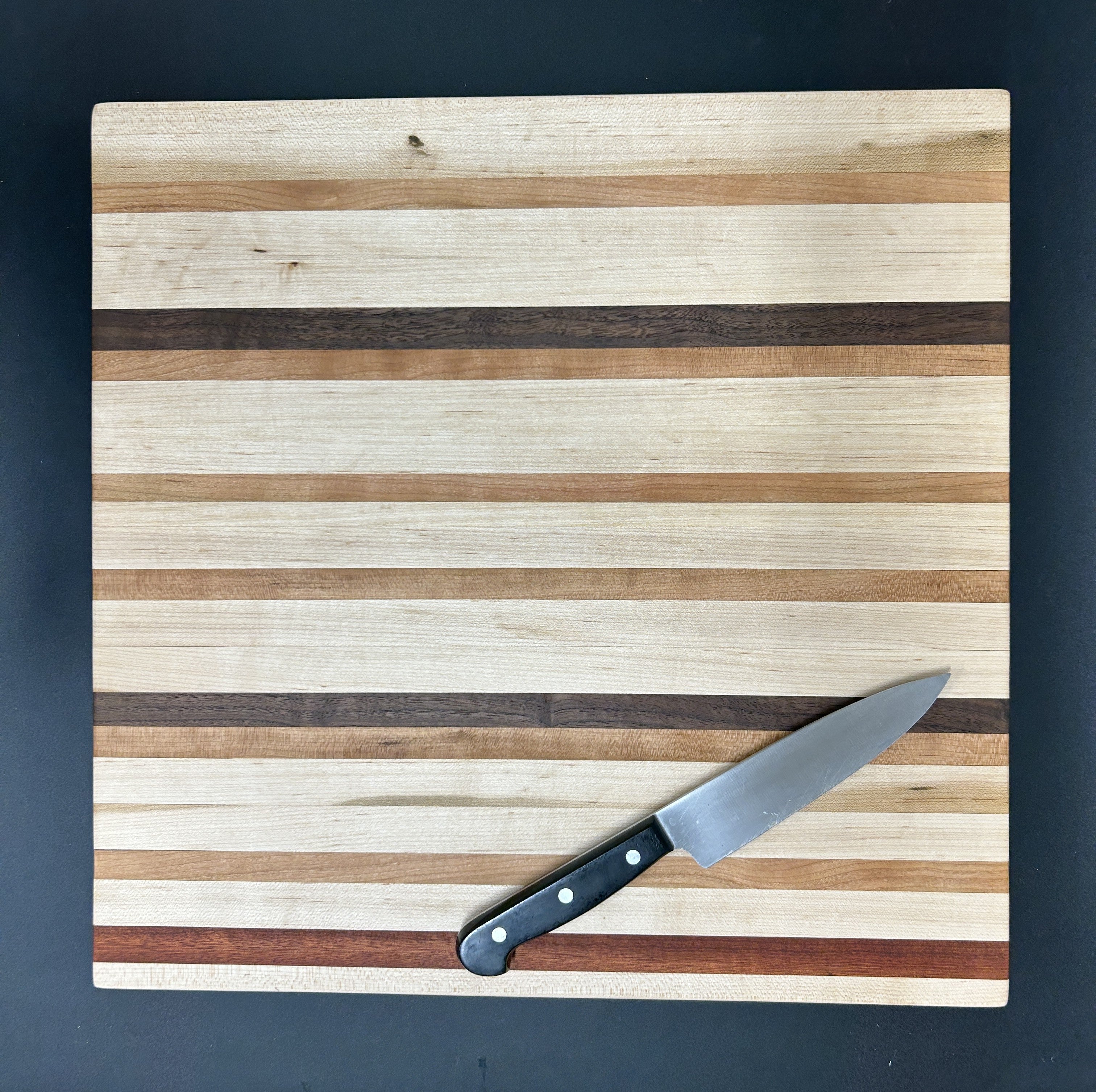 Handcrafted Mixed Hardwood Cutting Board – Striped Design
